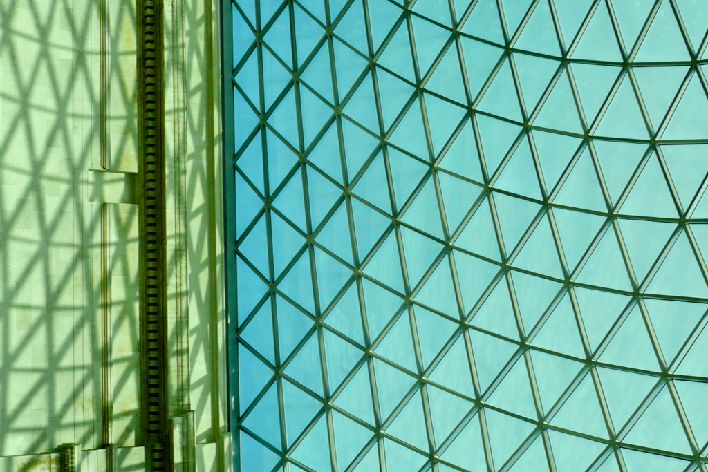 british library wall and glass roof, made of portland stone and triangular glass panes